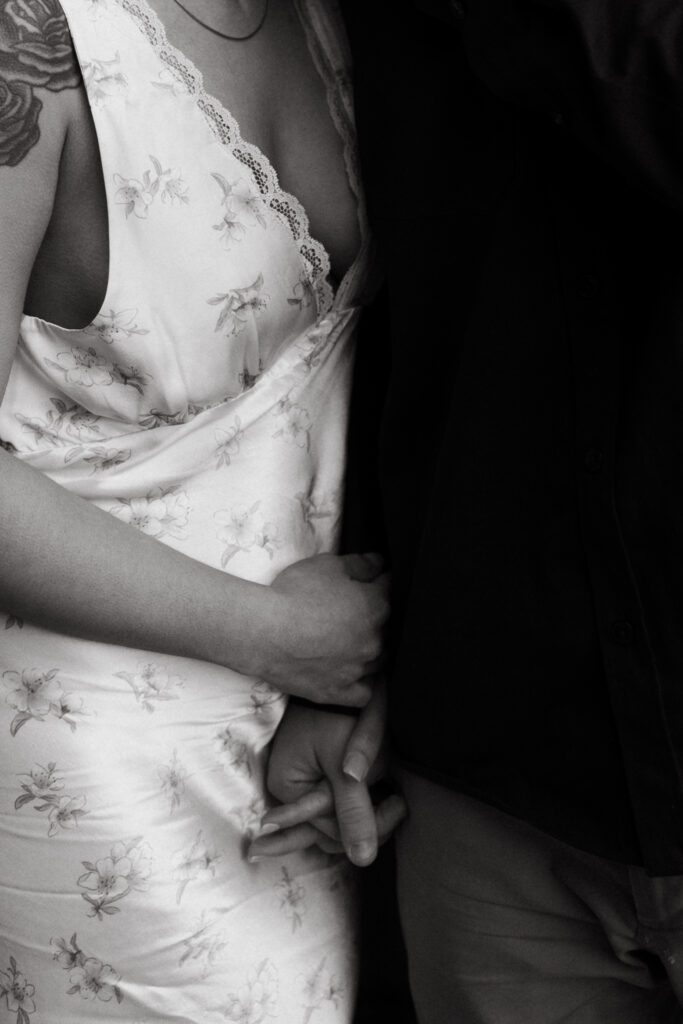 Romantic photo of couple holding hands